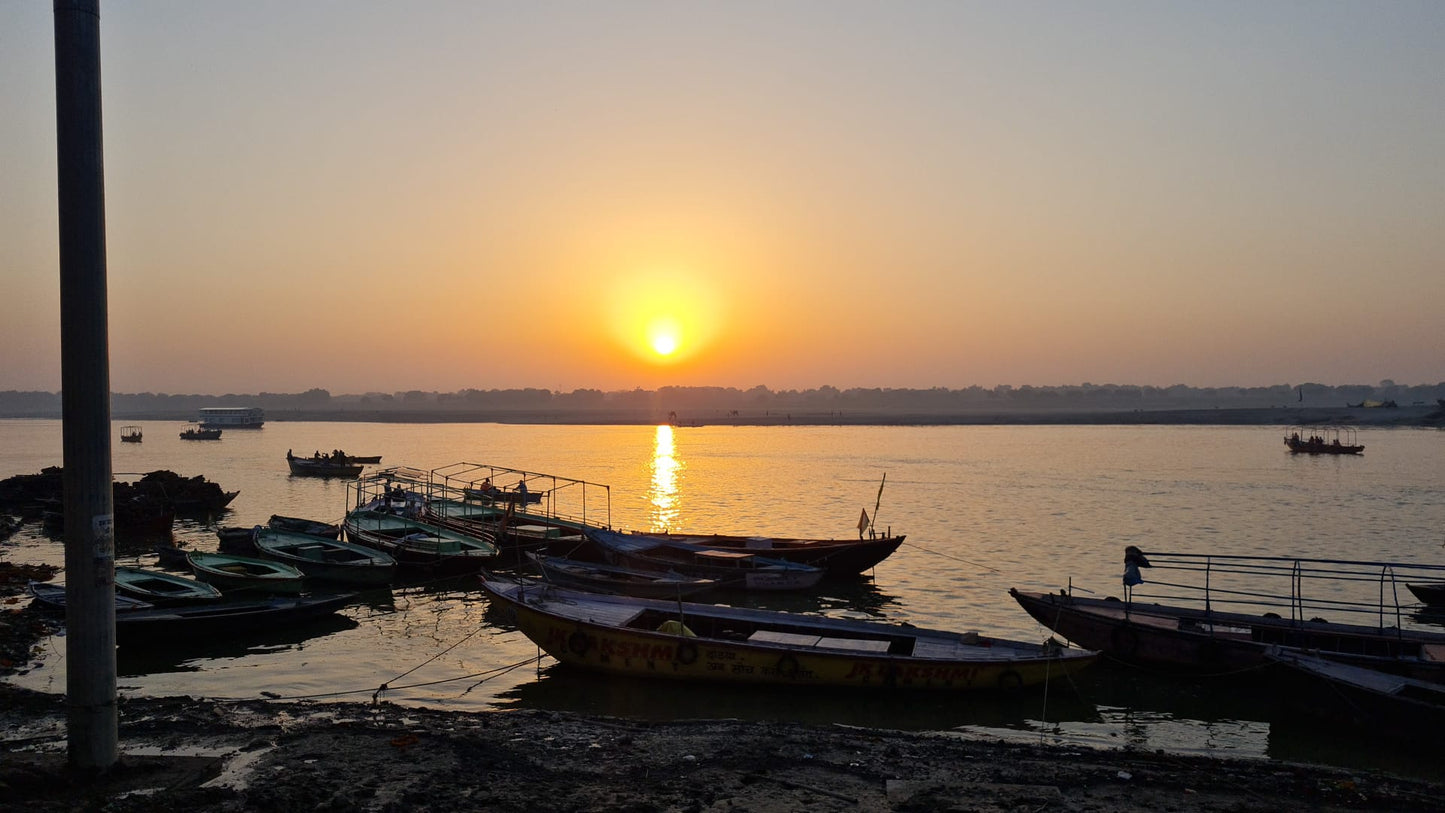 A luminous and uplifting original painting capturing one of the most transcendent experiences in India — watching the golden sun rise over the sacred Ganges at Varanasi. This scene from inspired MINA