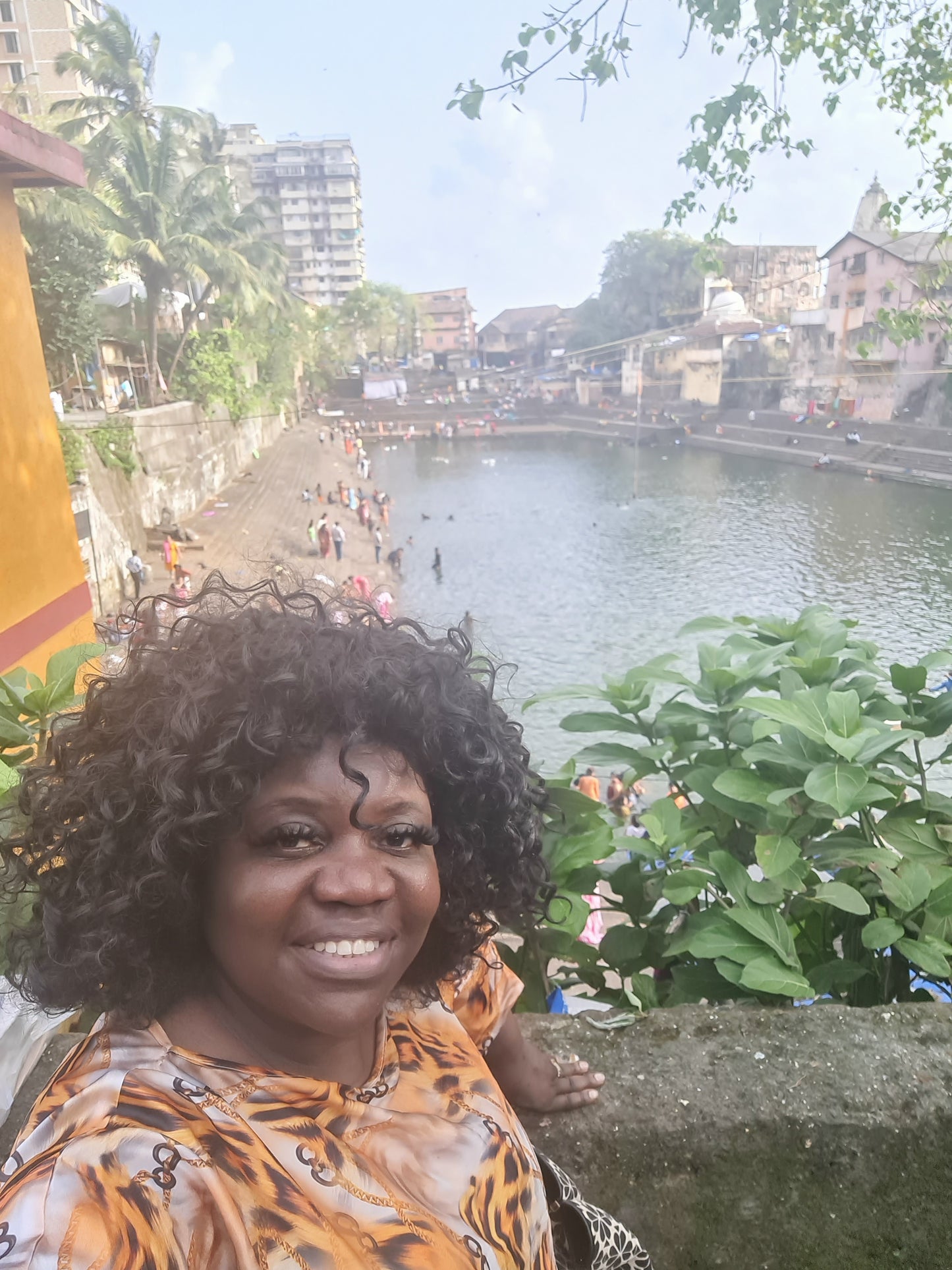 MINA visiting Banganga Water Tank in Mumbai, India, during the travel experience that inspired the painting Women at Banganga Water Tank — Mumbai.