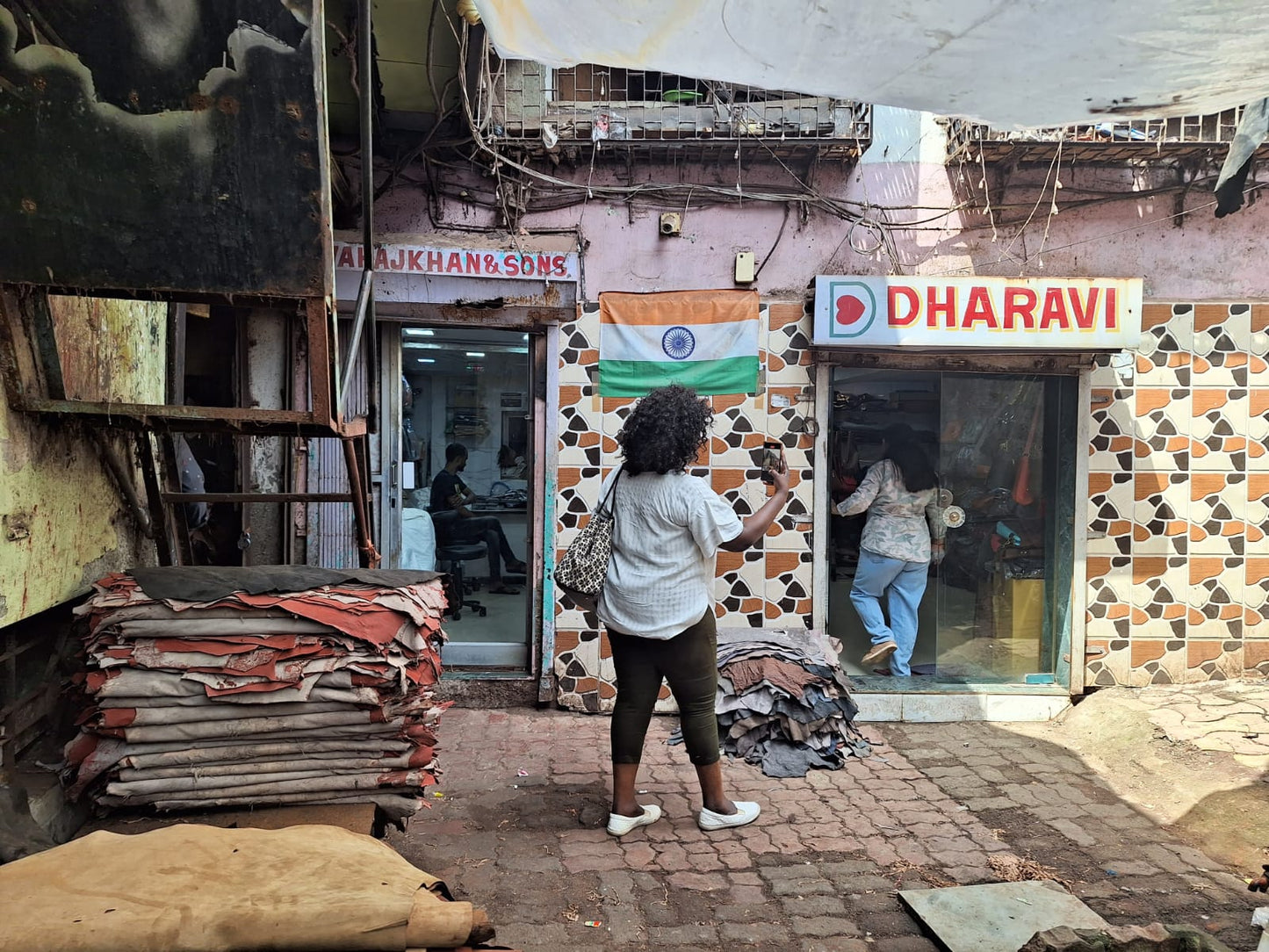MINA visiting Dharavi in Mumbai, India, during the travel experience that inspired the painting Resident of Dharavi — Mumbai.