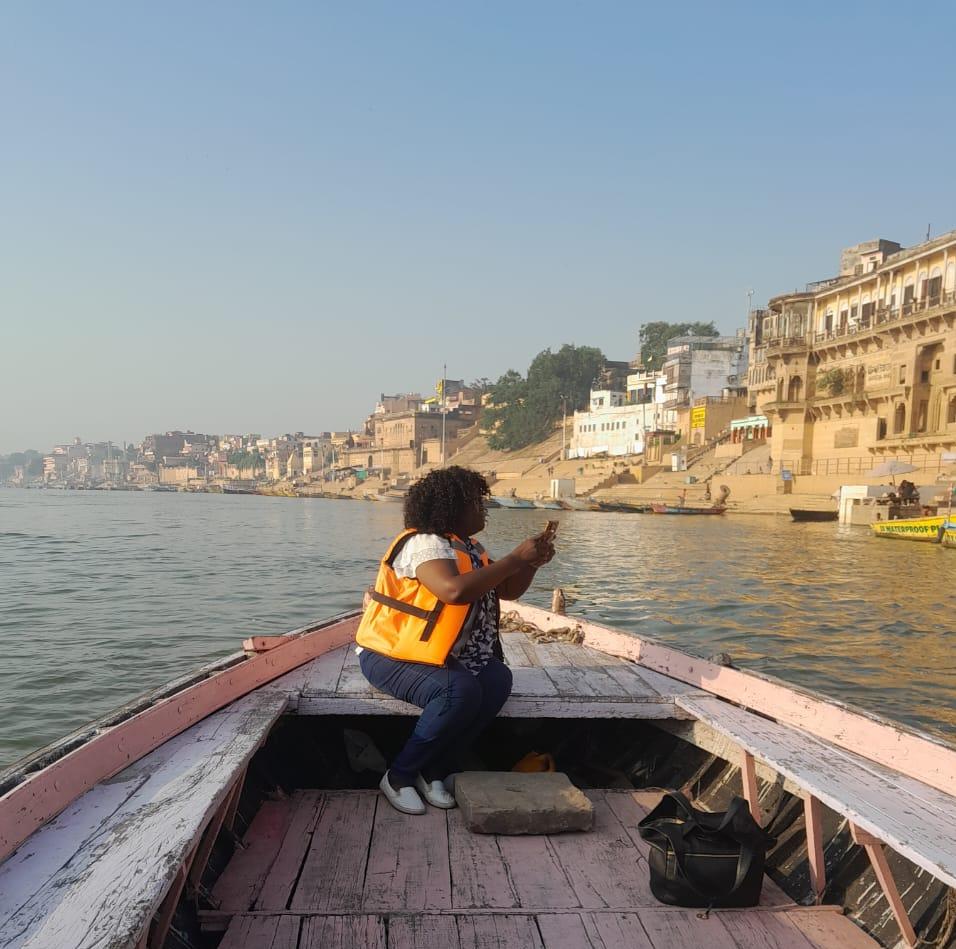 "During her four years living in India, MINA made numerous visits to Varanasi. This photograph captures the artist travelling by boat on the River Ganges while documenting the historic ghats that later inspired works within the Varanasi Collection."
