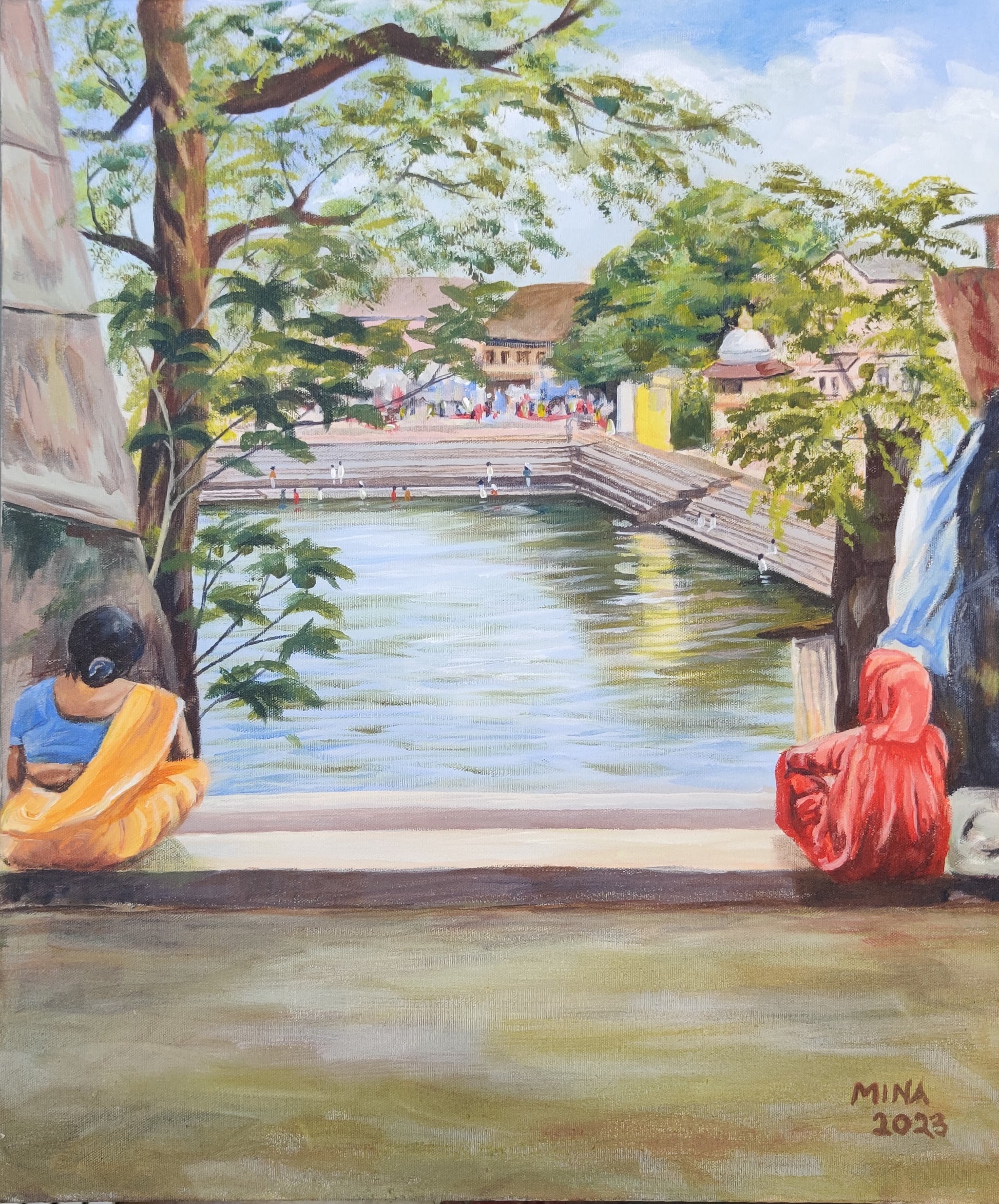 This painting captures a quiet, contemplative moment at the Banganga Water Tank in Walkeshwar, Mumbai — one of the city's oldest and most sacred heritage sites. Two women, dressed in vivid saffron and gold, sit at the edge of the ancient stepped tank, their backs to the viewer, absorbed in prayer, thought, or simply the stillness of the water before them.